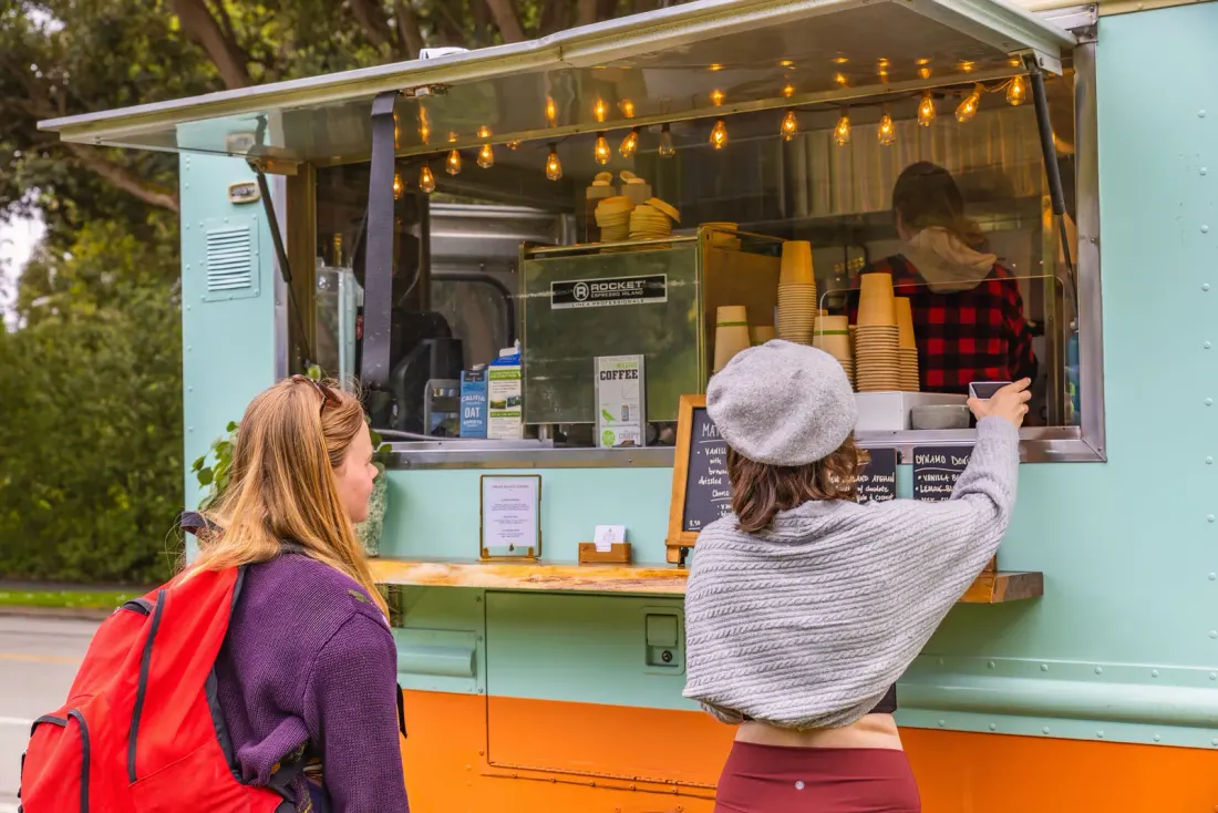 Food truck team preparing orders