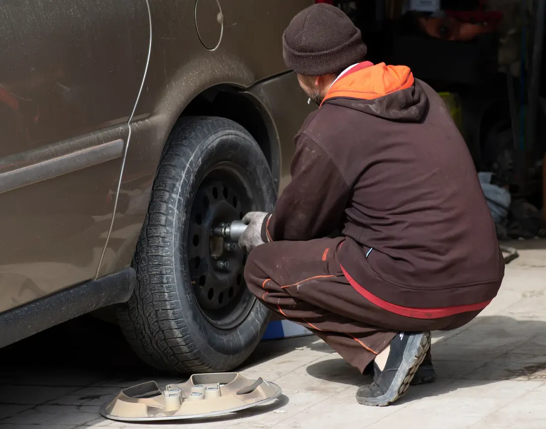 Technician changing a tire